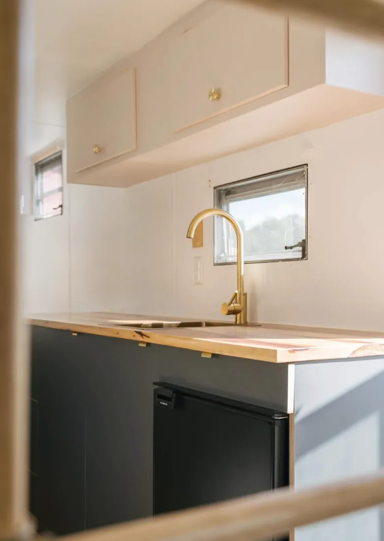Brass tapware on a timber top